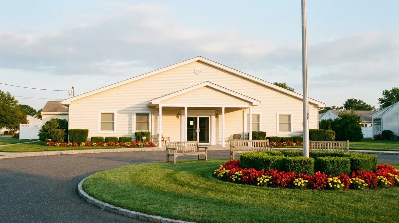 Clubhouse and landscaped entrance of an age-restricted community in Ocean County